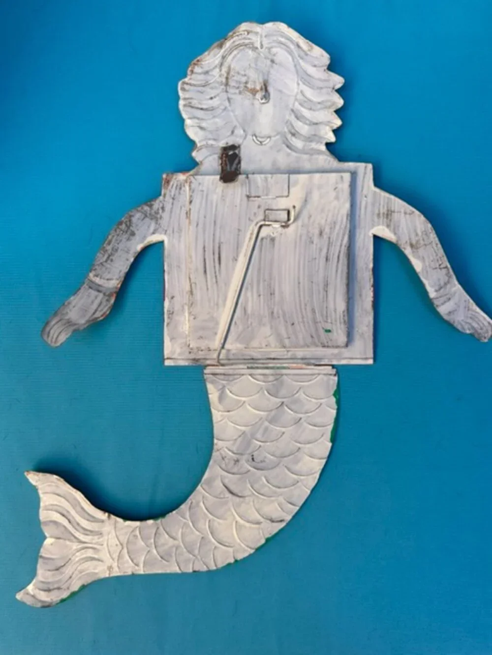 Redheaded painted tin mermaid with chest drawers that open to a mirror.